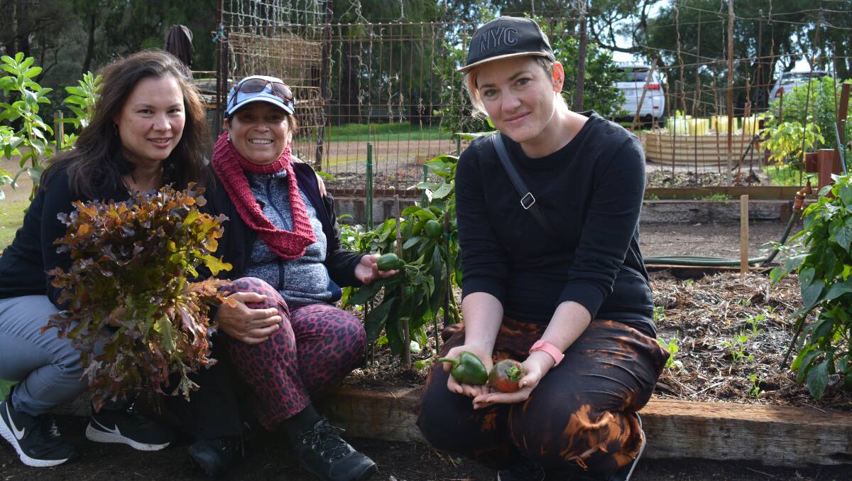 Grounded Women Gardening members Dianne Gregson, Liz Walsh and Amy Cross with some of the vegetables they have been able to harvest.