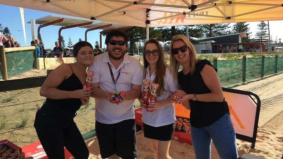 Triple M staff with Easter goodies at the Koombana Bay Foreshore.