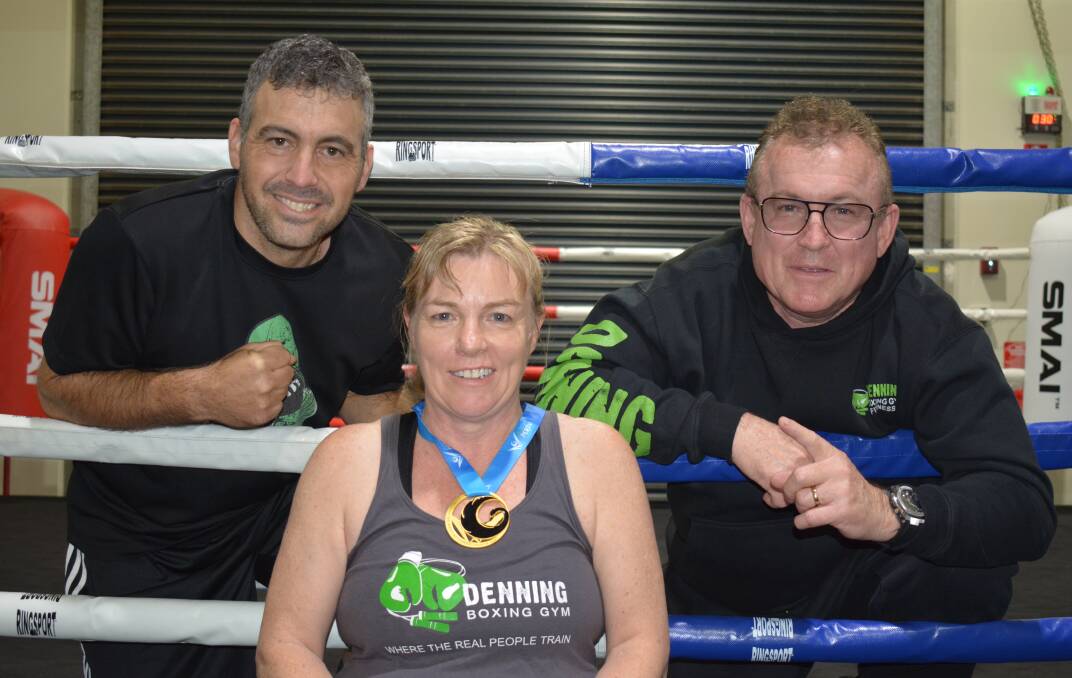Winner: Karen Nicholls took out gold in the National Masters competition for boxing. She is pictured with technical coach Dave and main coach John Hinsey.