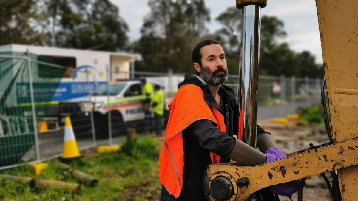 Richard Arapolu chained himself to machinery in a bid to prevent works at the Bussell Highway site. Picture: Supplied.