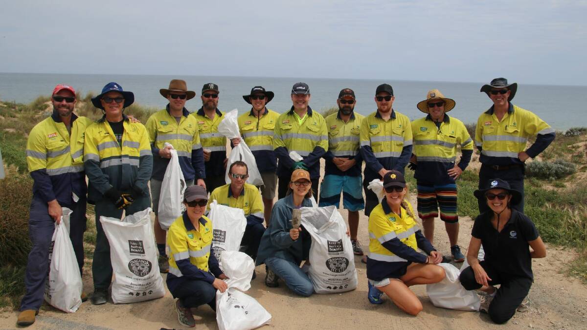 Iluka staff members teamed up with GeoCatch to help clean up Dalyellup Beach. Photo is supplied.