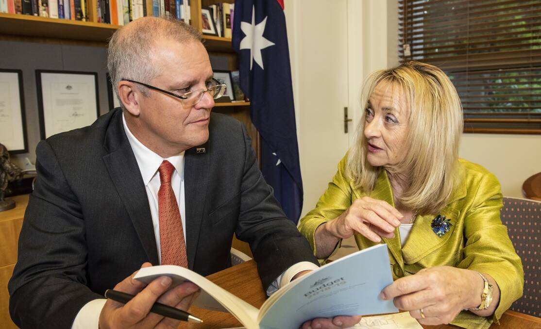 Federal treasurer Scott Morrison with Forrest MP Nola Marino looking over the budget. Photo is supplied.