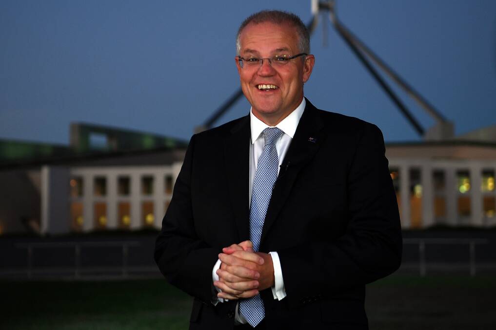 Goodies bag: Prime Minister Scott Morrison outside Parliament House during morning TV interviews after the federal budget was handed down on Tuesday night. Picture: AAP