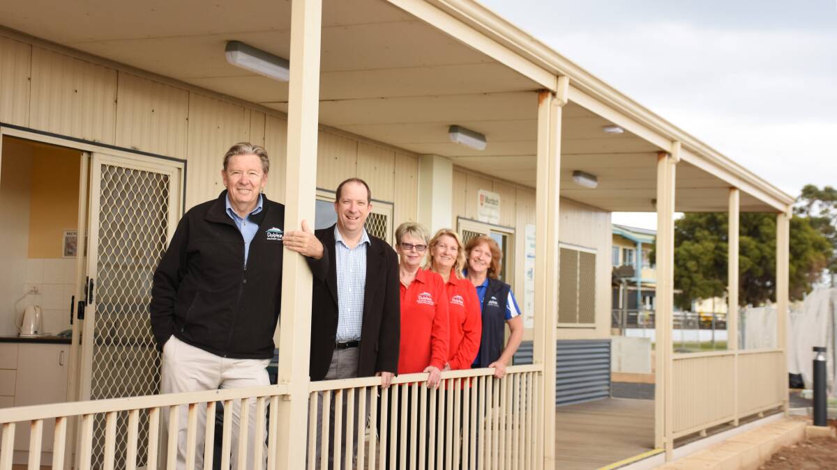 Dolphin Discovery Centre general manager David Kerr, South West Development Commission assistant director infrastructure Ashley Clements, DDC volunteers Jean Giles and Pam Maddison, and DDC volunteer coordinator Jan Tierney at the relocated volunteer and research building.