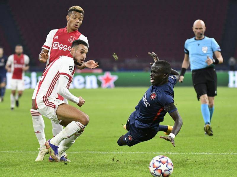 Socceroo Awer Mabil (r) scored for Midtjylland in their 3-1 Champions League defeat to Ajax.
