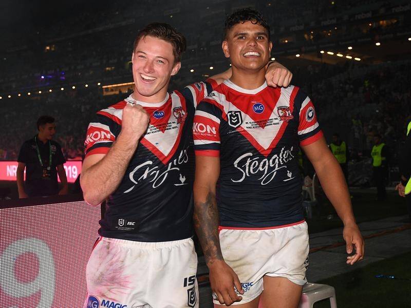 The Sydney Roosters' Latrell Mitchell (R) has broken his silence amid uncertainty on his NRL future.