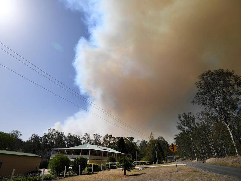 More than 50 fires are burning across Qld, including near Clumber in the Scenic Rim region.