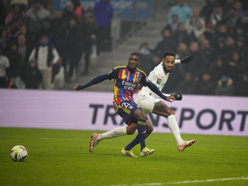 Pierre-Emerick Aubameyang (right) was the star turn as Marseille beat Lyon in the French league. (AP PHOTO)