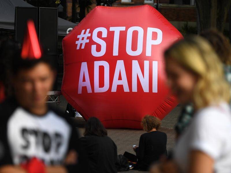 A new poll shows Queenslanders and Victorians agree on climate change, despite Adani mine conflicts.