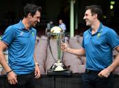 Mitchell Starc (left) and Pat Cummins with the Cricket World Cup trophy at the SCG. (Dan Himbrechts/AAP PHOTOS)
