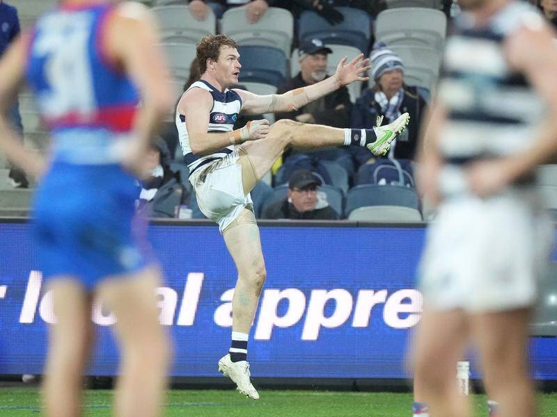 Gary Rohan of the Cats kicks the winning goal after the siren against the Western Bulldogs.