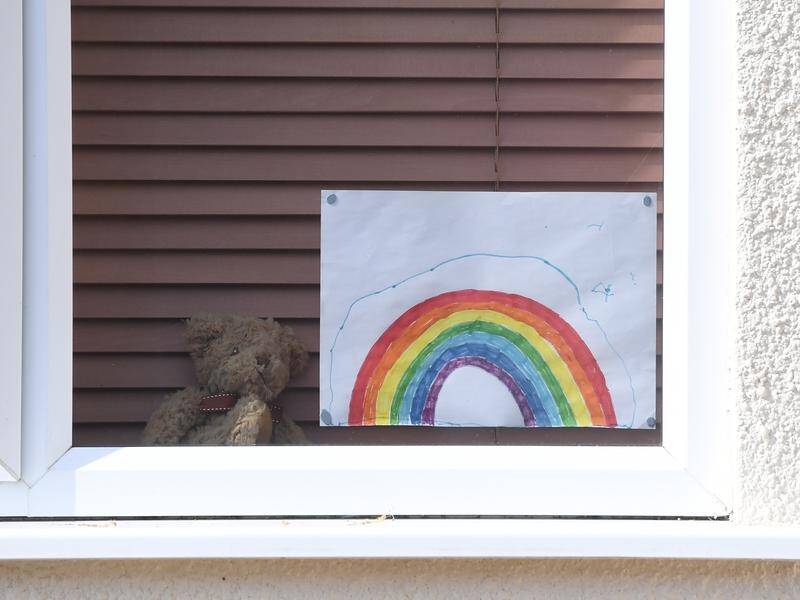 There is hope in the teddy bears stuffed in front windows of houses, conveying a message of love.