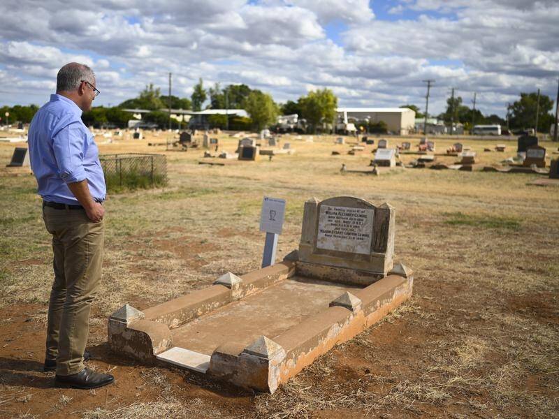 Prime Minister Scott Morrison visits his great great aunt Dame Mary Gilmore's grave in Cloncurry.