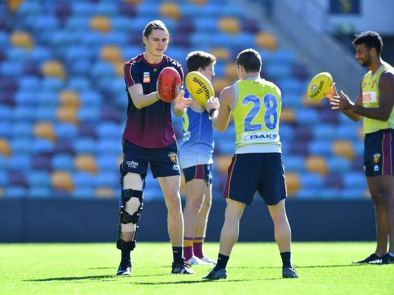 Lion Eric Hipwood (left) is still in doubt for his side's clash with Port Adelaide.