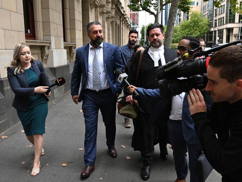 Laith Hanna (2nd left) has avoided jail time but his company has been fined $1.3 million. (James Ross/AAP PHOTOS)