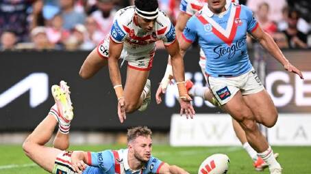 Sam Walker scores a try for the Roosters who hammered St George Illawarra in the Anzac Day clash. (Dan Himbrechts/AAP PHOTOS)
