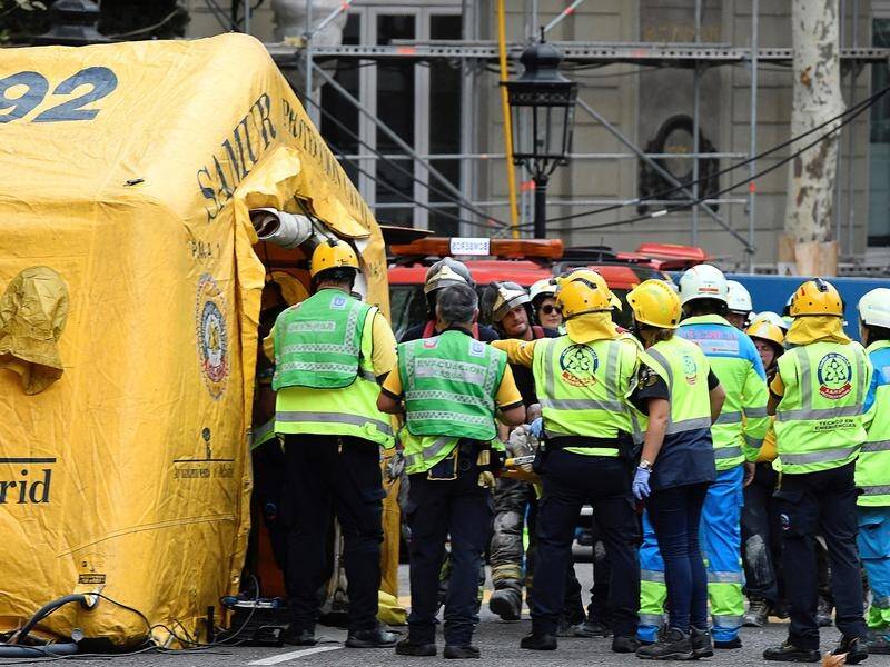 A worker has been killed and 11 are injured after scaffolding on Madrid's Ritz Hotel collapsed.