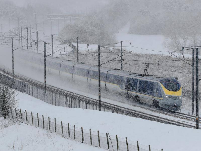 Heavy snowfall has disrupted travel across the UK, with roads, trains and planes all affected.
