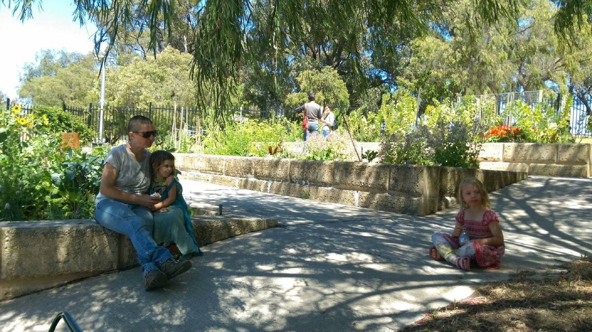 PEACEFUL: Lee Wilde and her daughter enjoying the tranquility of the Bunbury garden. Photo: Sharon Gear