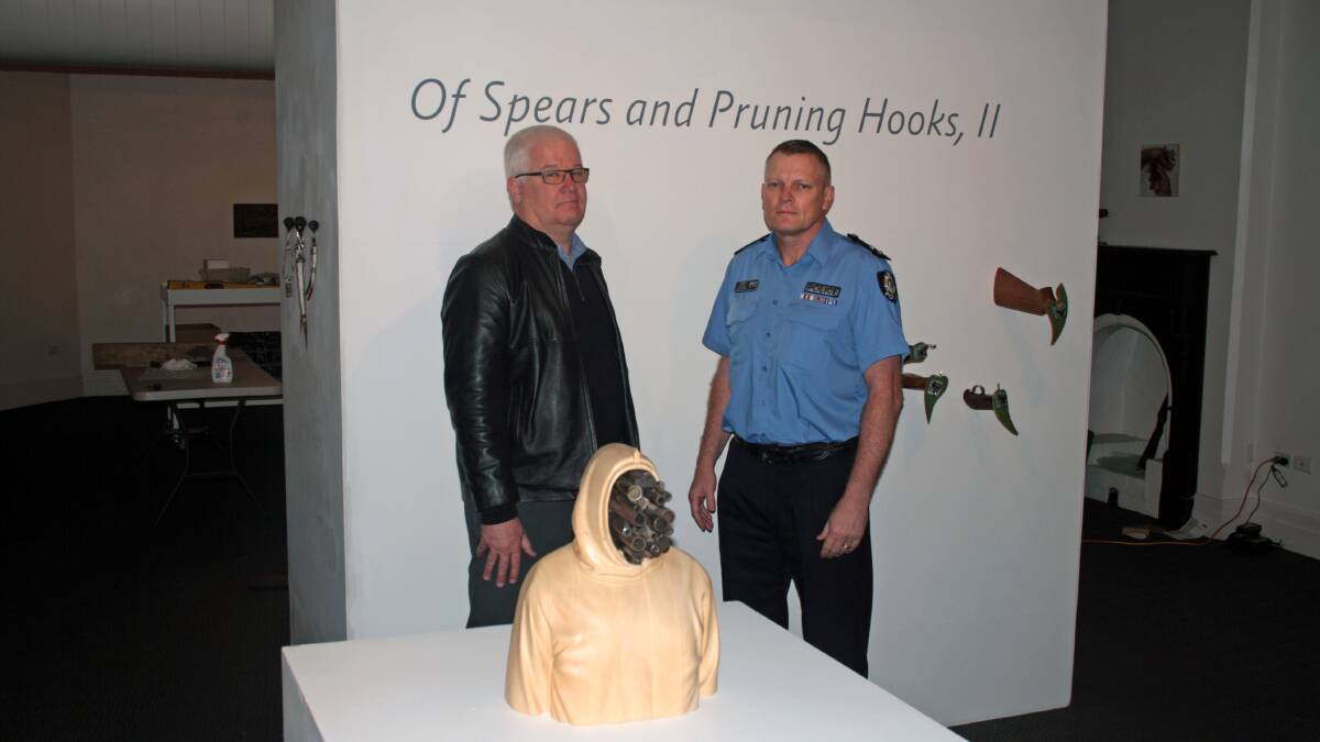 South West District Superintendent Peter Hatch with Bunbury Regional Art Galleries director Julian Bowron at the Of Spears and Pruning Hooks II exhibition which opens on Friday. 
