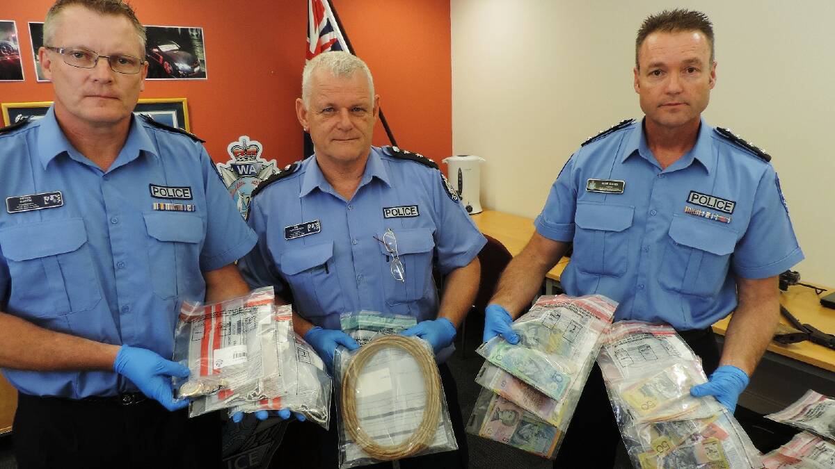 South West Police Superintendent Peter Hatch, Inspector Kim Hutchinson and Inspector Pete Davies hold some of the items seized during six days of drug raids across the South West. Photo: Anne-Maree Leonard/Bunbury Mail.