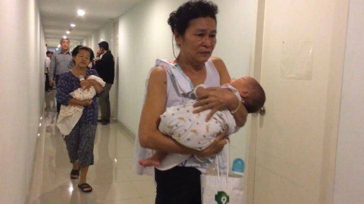 Two of the babies found with surrogate mothers in a Bangkok condominium. Photo: Thai Rath TV.
