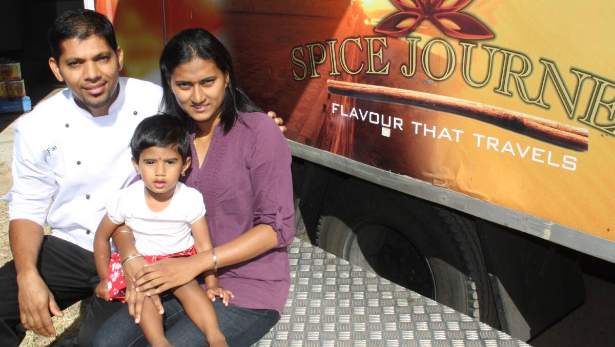 Spice Journey owner Falgunan Nanukurup, pictured with his wife Navajothy Arasan and his two-year-old daughter Harshatha, is looking forward to the Multicultural Night Under the Stars. 