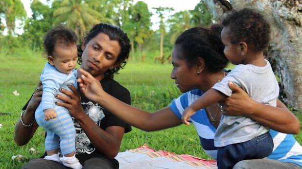 Rohingya refugee Alex Rashid and his wife Molly and children on Manus Island Photo: GetUP
