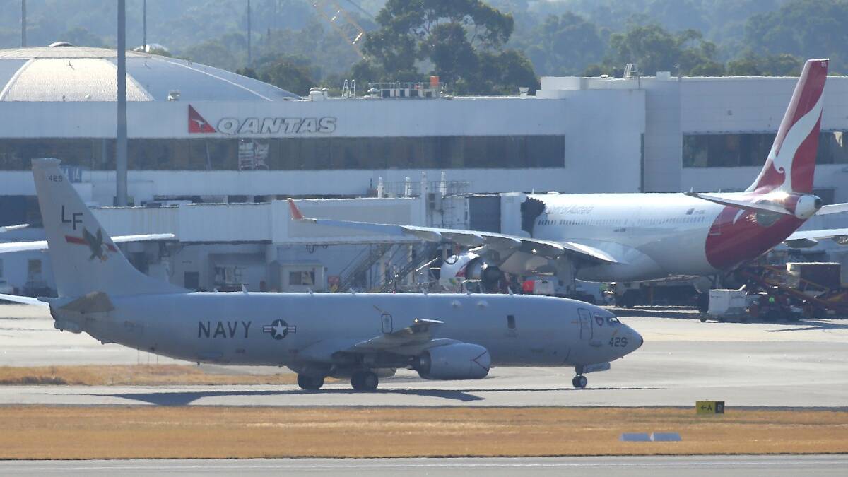 A US Naval surveillance aircraft invloved in the search for the missing Malaysian Airlines flight MH370 is seen after landing at Perth airport on March 19 in Perth. Photo: Getty Images.