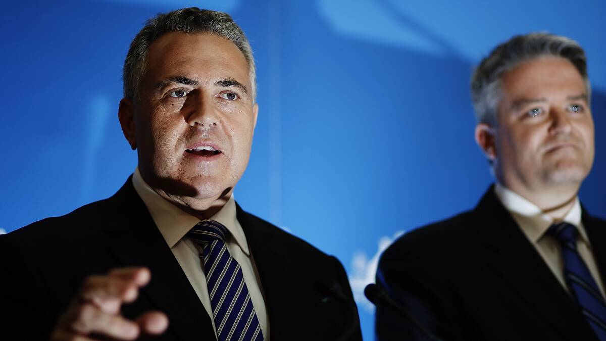 Treasurer Joe Hockey and finance minister Mathias Cormann at Parliament House on Tuesday evening. Hockey delivered a tough budget with cuts to education, health and welfare.  WA will be delivered road infrastructure funding, a new anti-gangs aquad and initiatives designed to improve remote indigenous communities. Photo: Stefan Postles/Getty Images.