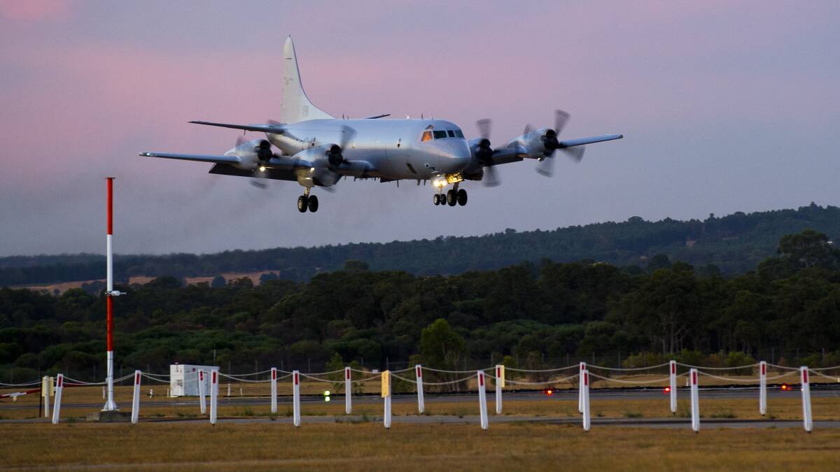 A Royal Australian Air Force AP-3C Orion aircraft from 10 Squadron, No 92 Wing, arrives March 18, 2014 at RAAF Base Pearce, Western Australia. The aircraft is to join the Australian Maritime Safety Authority-led search for Malaysia Airlines Flight MH370 in the southern Indian Ocean. Photo: Getty Images.