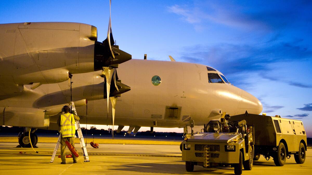 A Royal Australian Air Force AP-3C Orion aircraft from 10 Squadron, No 92 Wing, has post-flight checks conducted by maintenance personnel March 18, 2014 after its arrival at RAAF Base Pearce, Western Australia. The aircraft is to join the Australian Maritime Safety Authority-led search for Malaysia Airlines Flight MH370 in the southern Indian Ocean. Photo: Getty Images.