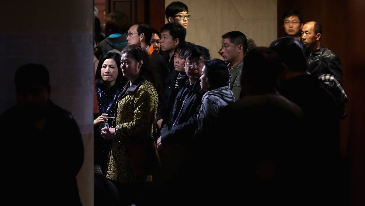 Chinese relatives of the passengers onboard Malaysia Airlines flight MH370 wait for the latest information at Lido Hotel on March 20, 2014 in Beijing, China. Photo: Getty Images.
