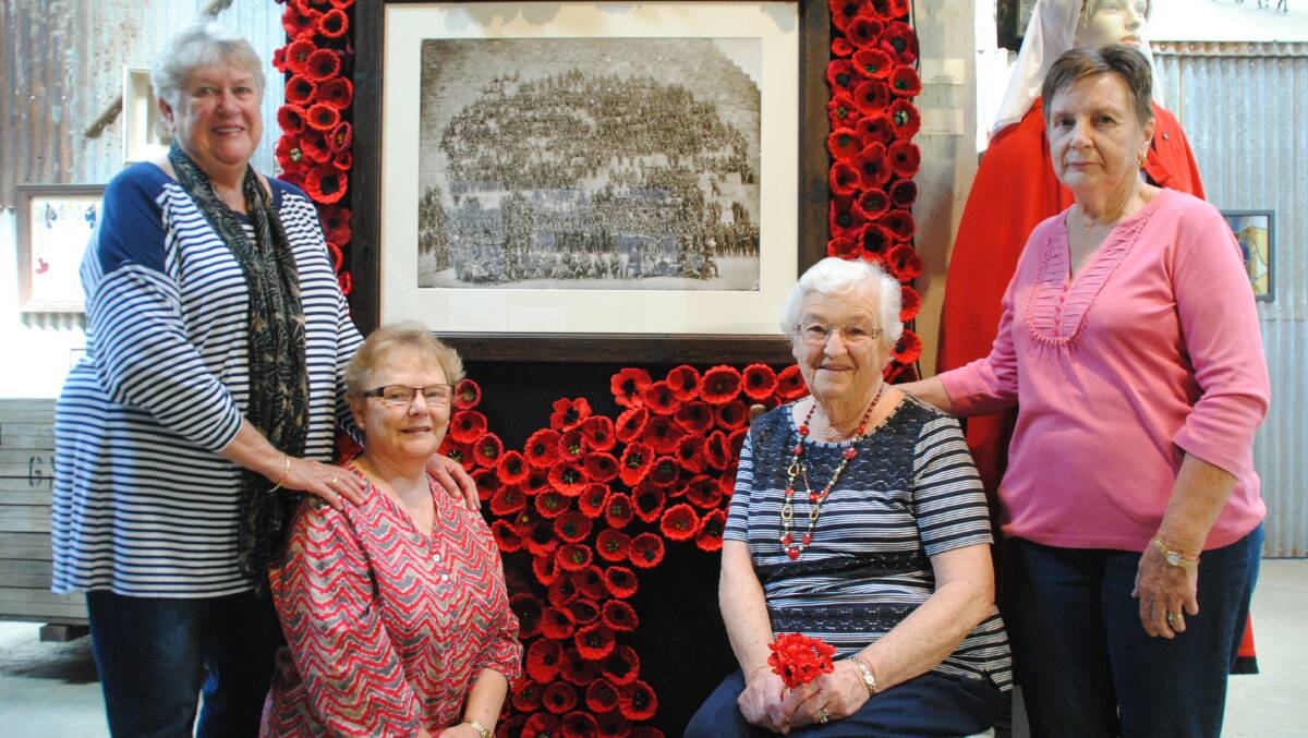 Ros Price, Yvette Buxton, Pam McRorie and Mary Kerklaan proudly display the poppies they have made so far. 