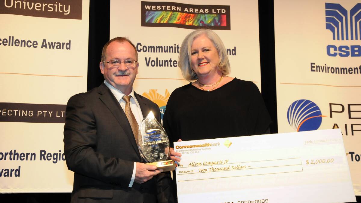 Bunbury woman Alison Comparti received her 2014 Regional Achievement and Community Award from Western Areas Ltd managing director and chief executive Dan Lougher. 