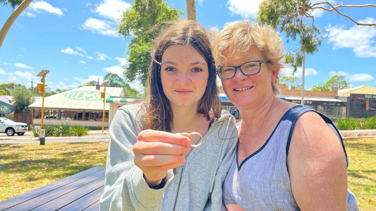 Georgia Morris and mum Kathy with the ring Georgia found off Redgate Beach. Photo: Nicky Lefebvre