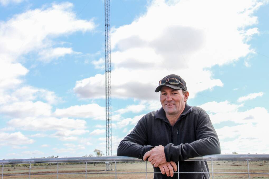 Andrew Sevil beside his 53m telecommunications tower.