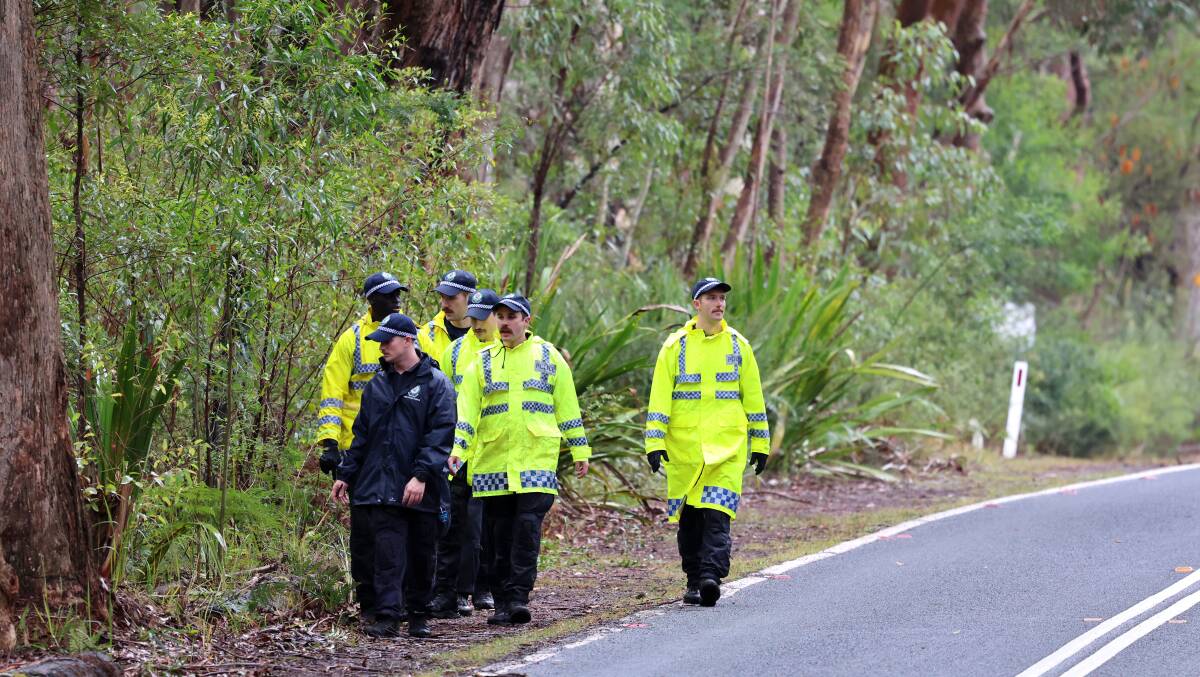 Police are combing bushland at Waterfall in the Royal National Park after skeletal remains of a person were found inside a burnt-out car early Tuesday morning. Picture by Sylvia Liber