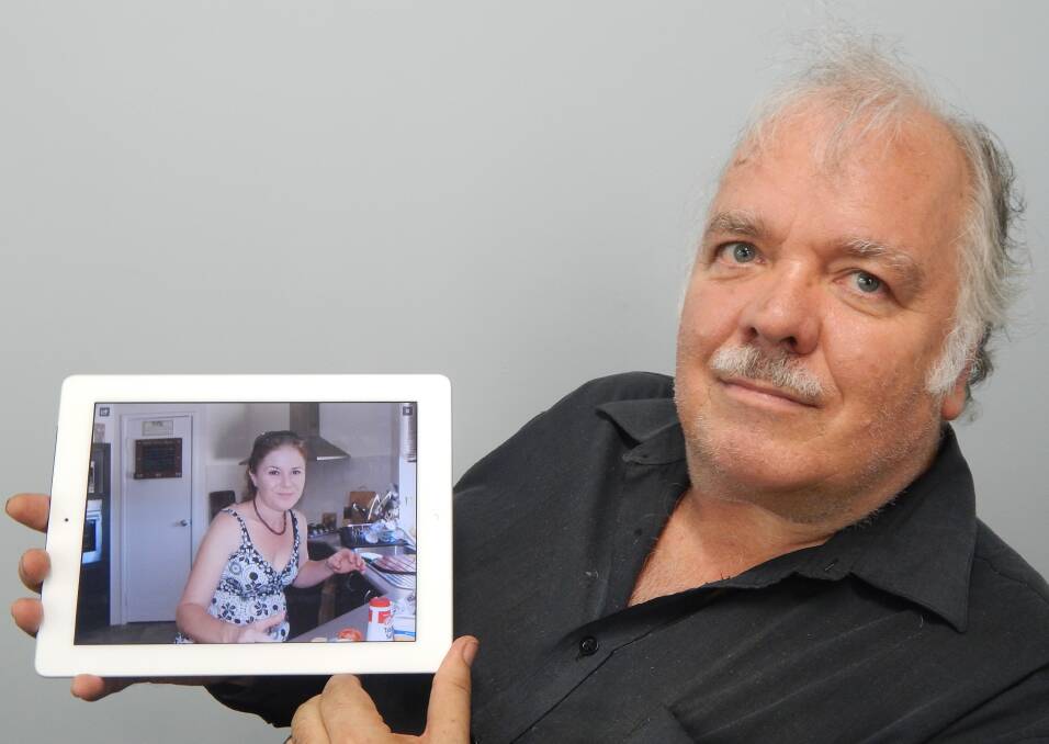 Father's grief: Mark Hutchings with a photo of his late daughter Sharon Camisa, who died from Legionnaires Disease.
