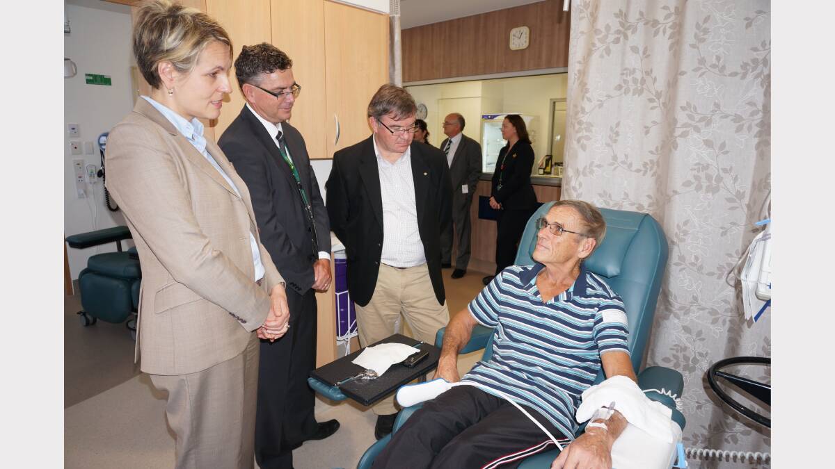 Federal health minister Tanya Plibersek, St John of God Bunbury Hospital chief executive officer Mark Grime and state resources minister Gary Gray talk to cancer patient John Vergeer at Bunbury’s new comprehensive cancer centre.