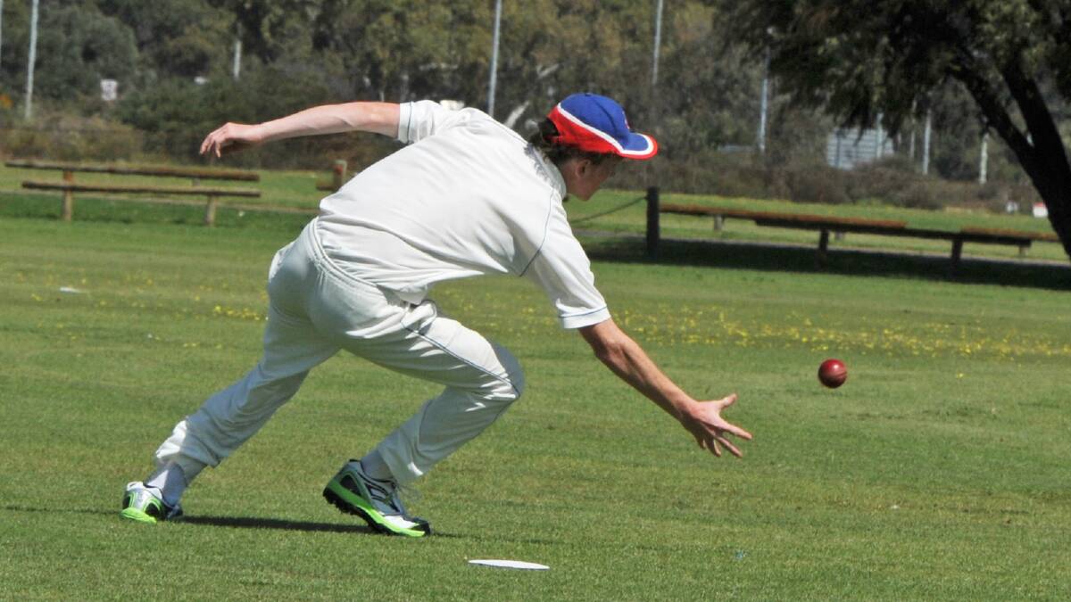Josh Webb tries to hold a sharp catch off the bowling of Shannon Prentice.