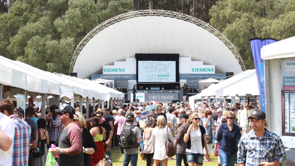 Thousands of people exploring the food and wine tents.