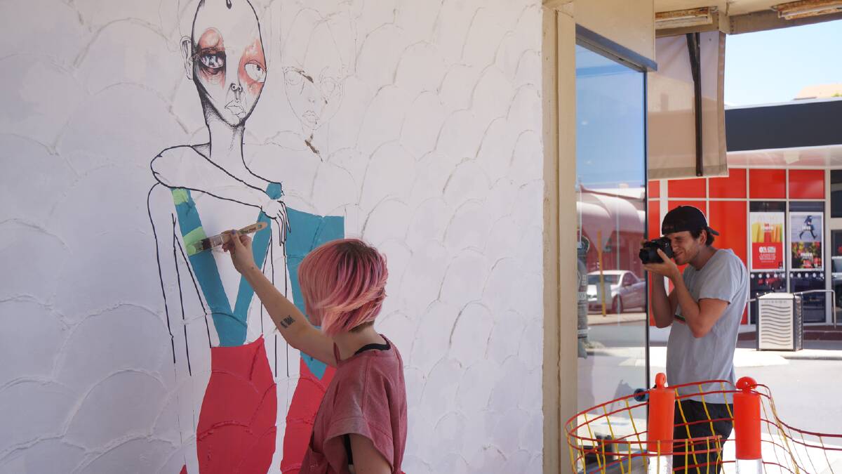 Jodee Knowles gets her creative juices flowing on The Wombat Lodge's wall on Prinsep Street. 